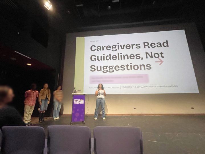 A student team presenting their findings on stage at the Children's Discovery Museum